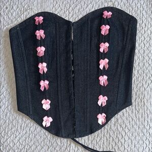 Black denim corset with pink bows